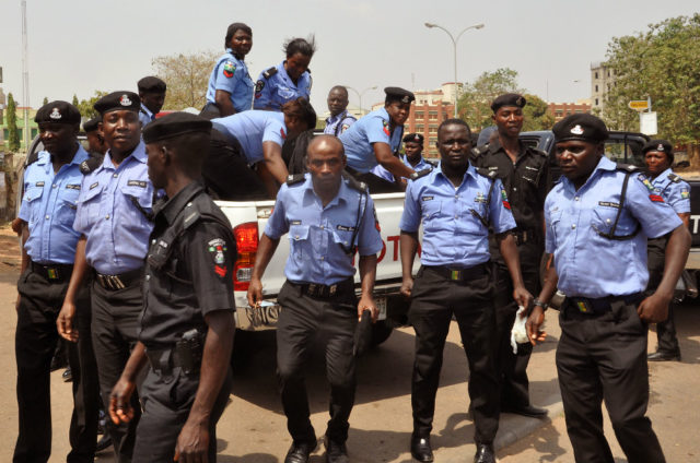 Nigerian policemen working to curb crime