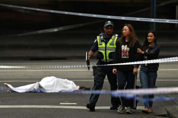 A dead victim of the knife attack in Melbourne Australia and a person being asked to leave the area by police