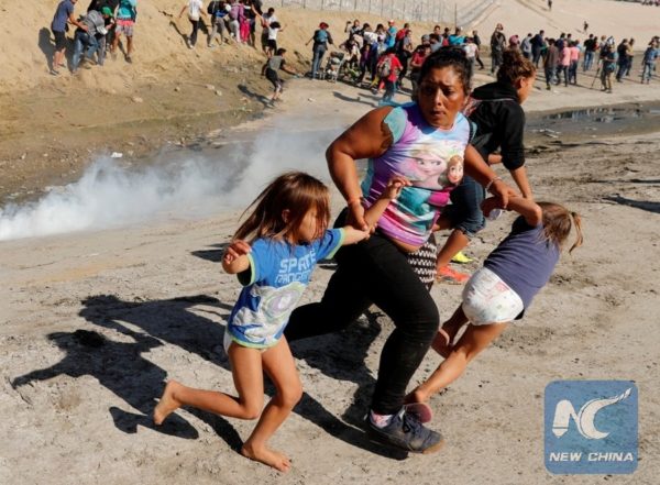 Central American migrants teargassed by America. Photo Xinhua
