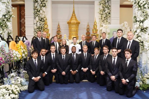 Leicester City players and officials with Aiyawatt Srivaddhanaprabha, in Bangkok on Sunday