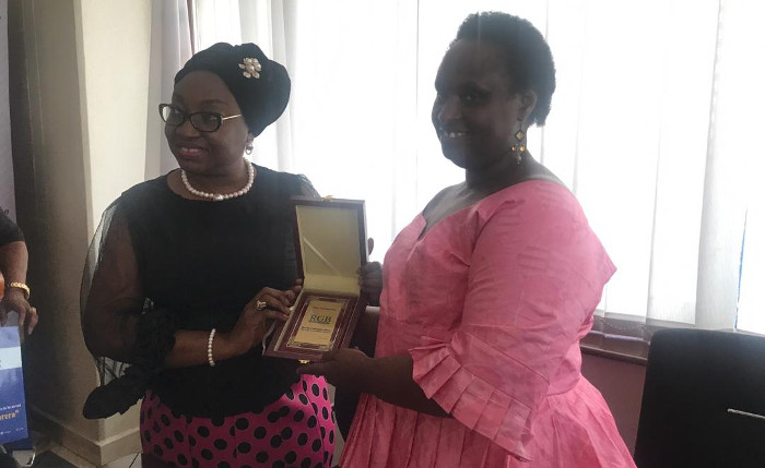 Mrs Winifred Oyo-Ita, Head of Civil Service of the Federation receiving a gift from Dr. Usta Kaitesi, Deputy, Chief Executive Officer Rwanda Governance Board as Rwanda