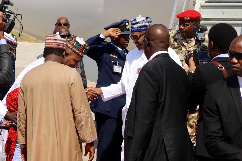 President Muhammadu Buhari in a handshake with Gov. Kashim Shettima of Borno State