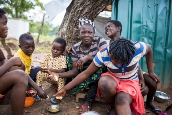 Some Cameroonian refugees in Nigeria share a meal