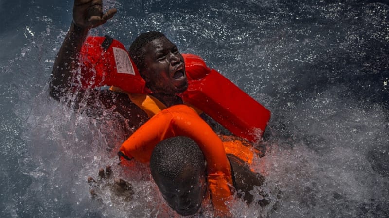 Migrants struggling at mid sea after boat capsizes 